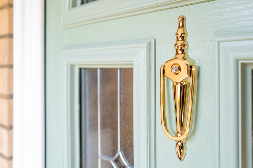 Composite door with gold hardware
