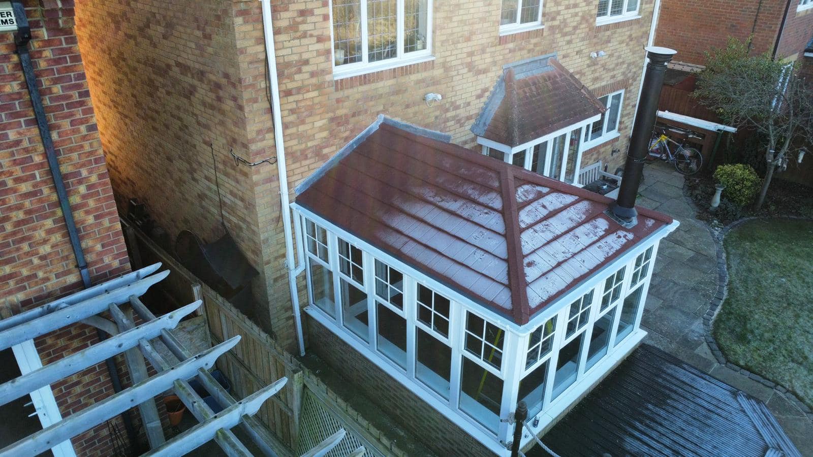 Tiled overlay conservatory roof with chimney